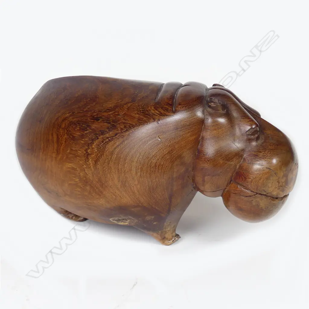 An African carved hardwood figure of a standing hippopotamus Image 1++