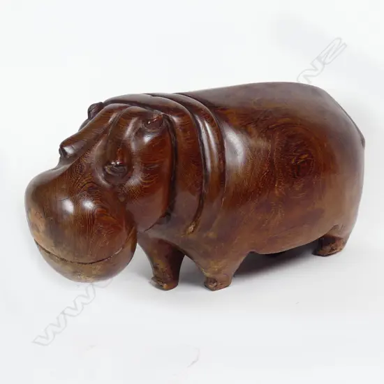 An African carved hardwood figure of a standing hippopotamus