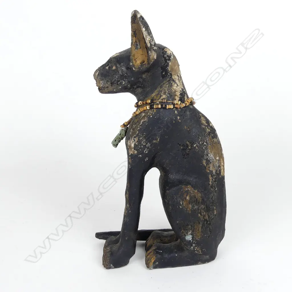 An Egyptian wooden carved cat Image 1++