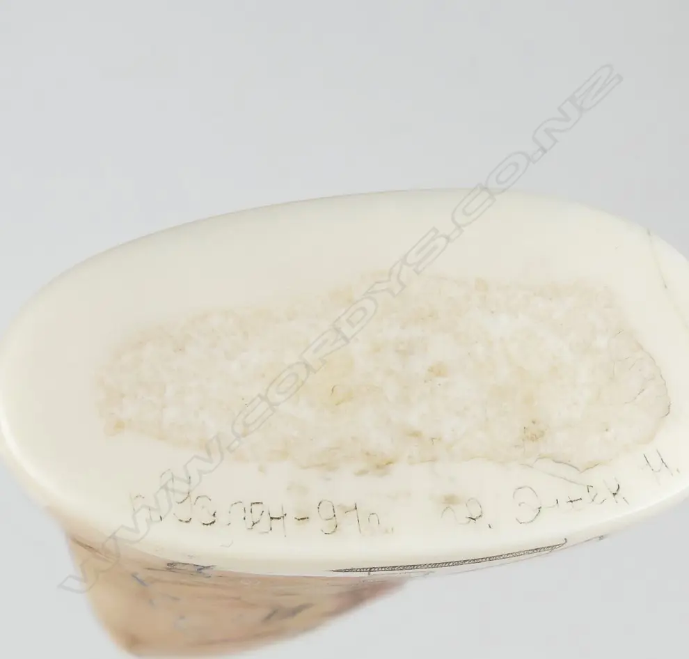 An Inuit scrimshaw walrus tusk Image 1++