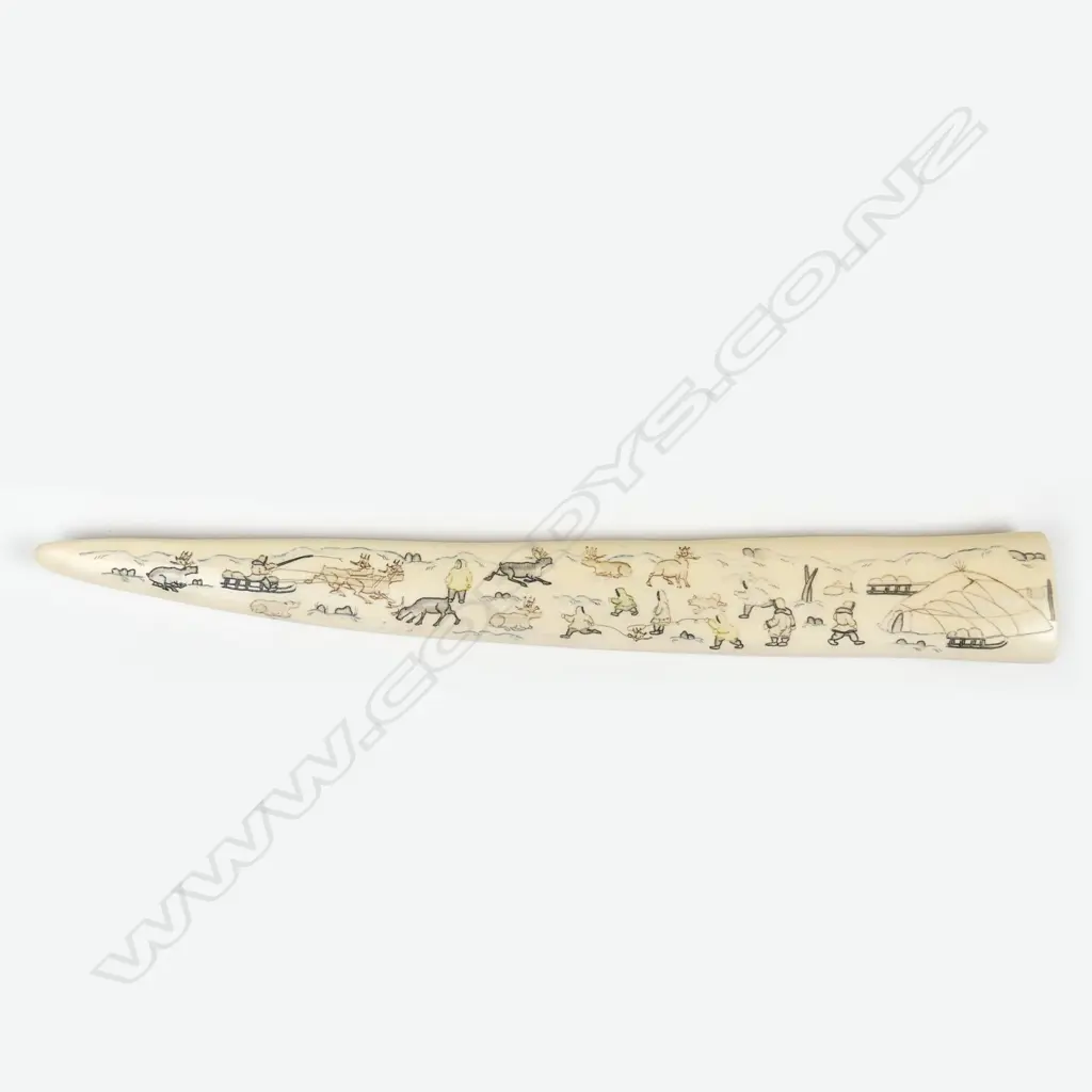 An Inuit scrimshaw walrus tusk Image 1++