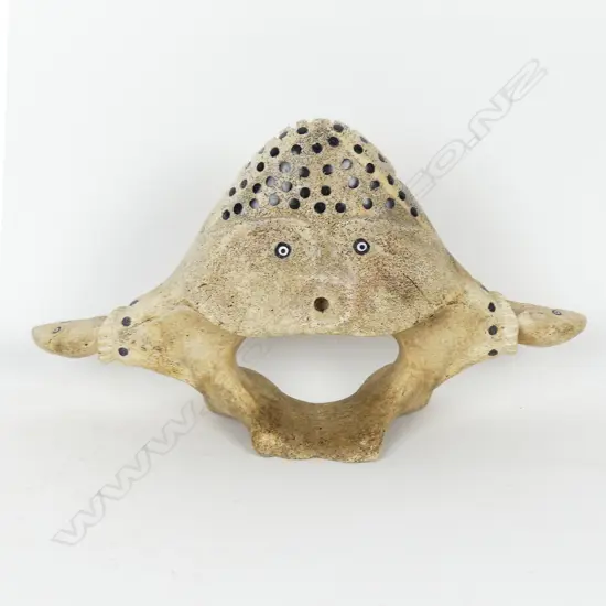 An Inuit bone and mammoth ivory carving