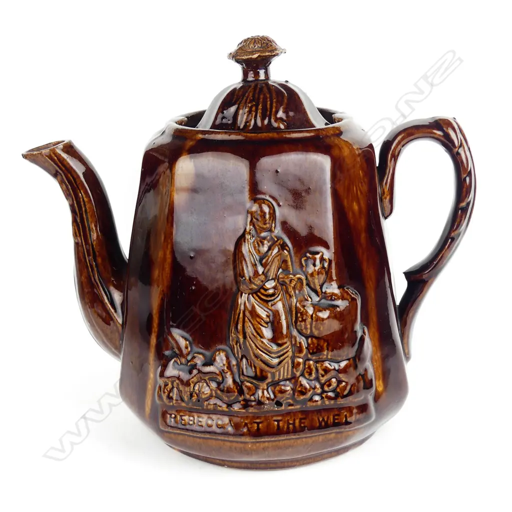 A Victorian Rockingham glazed 'Rebecca At the Well' teapot Image 1++