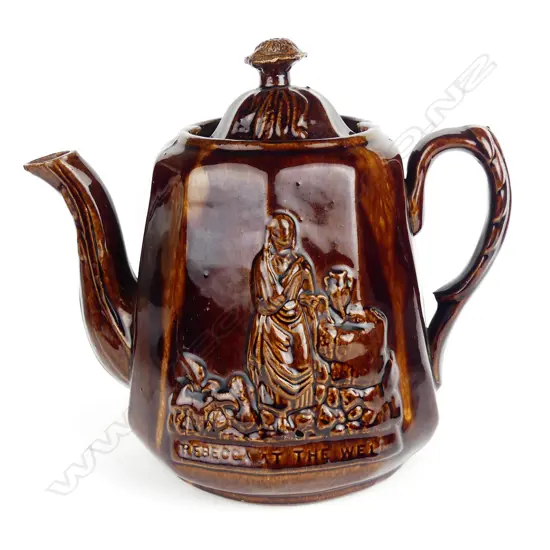 A Victorian Rockingham glazed 'Rebecca At the Well' teapot