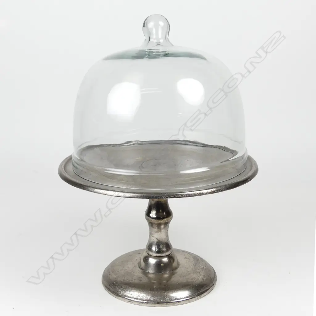 An aluminum cake stand with glass cover Image 1++