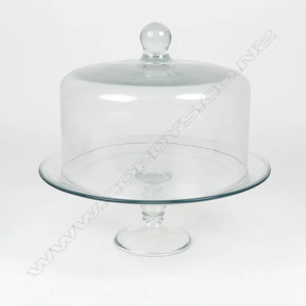 A clear glass cake stand and cover Image 1++