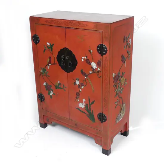 A Chinese small lacquered two door cabinet
