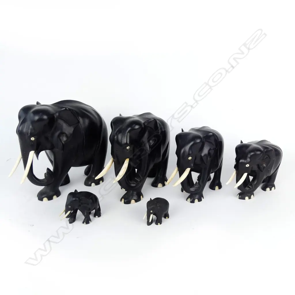 A graduated set of six ebony elephants Image 1++