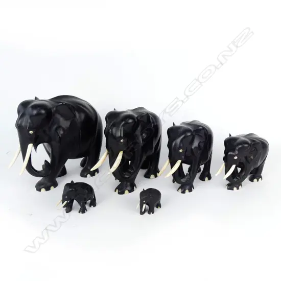 A graduated set of six ebony elephants