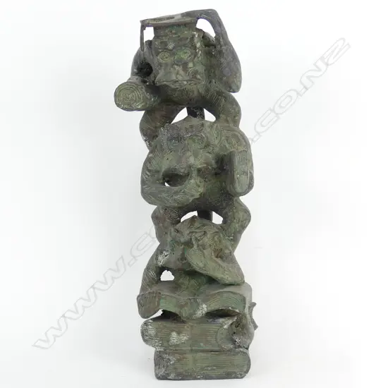 A bronze sculpture of three wise monkeys