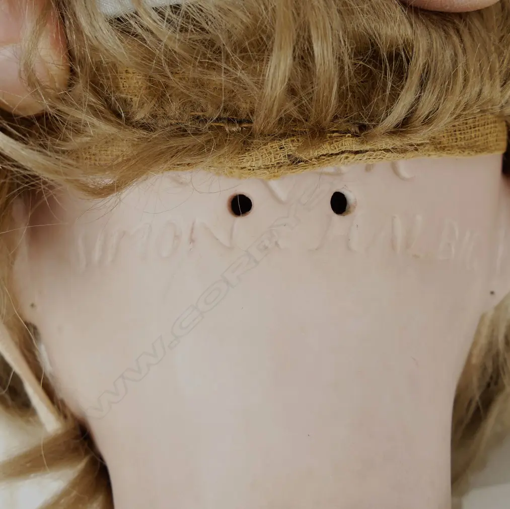 An antique Simon Halberg doll Image 1++