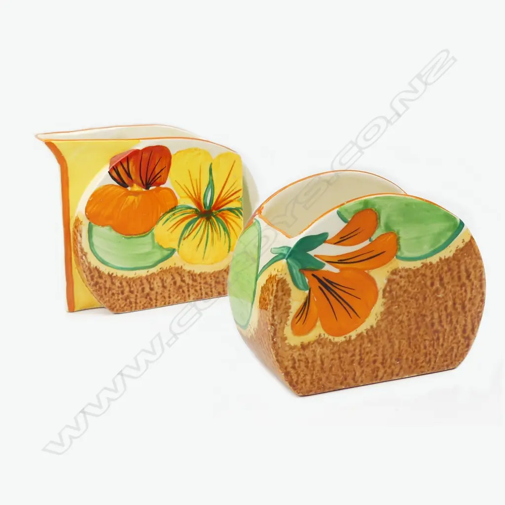 A Clarice Cliff Bizarre cream and sugar Image 1++