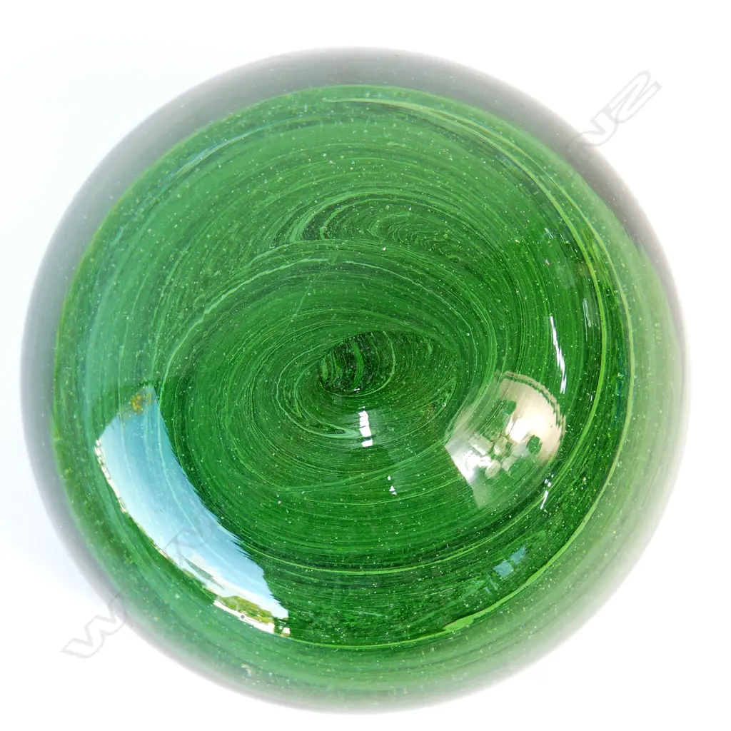 A late 19thC green glass paperweight Image 1++