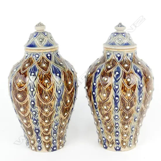 A pair of Doulton Lambeth lidded baluster urns