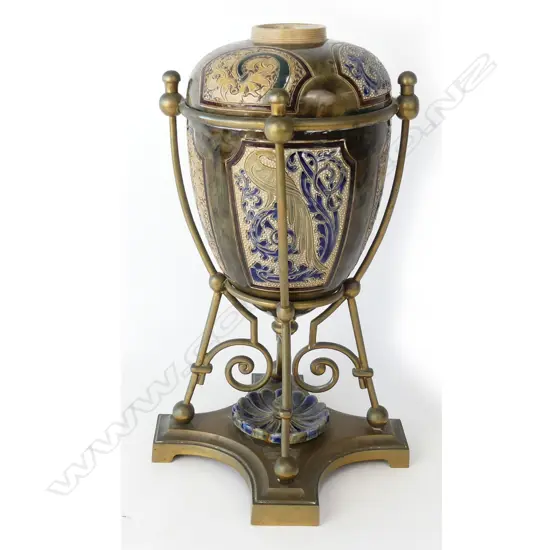 A Doulton Lambeth stoneware oil lamp decorated by Mark V. Marshall