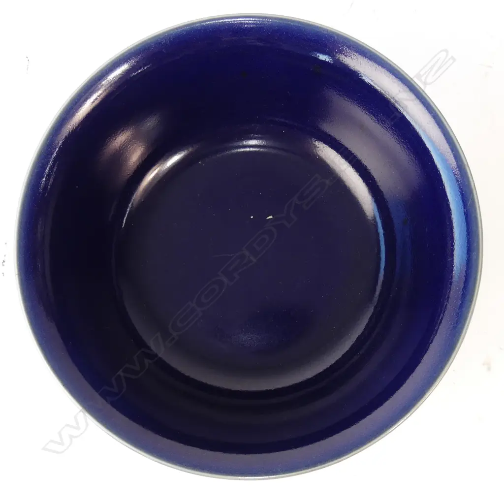 A Chinese monochrome blue glazed footed bowl Image 1++