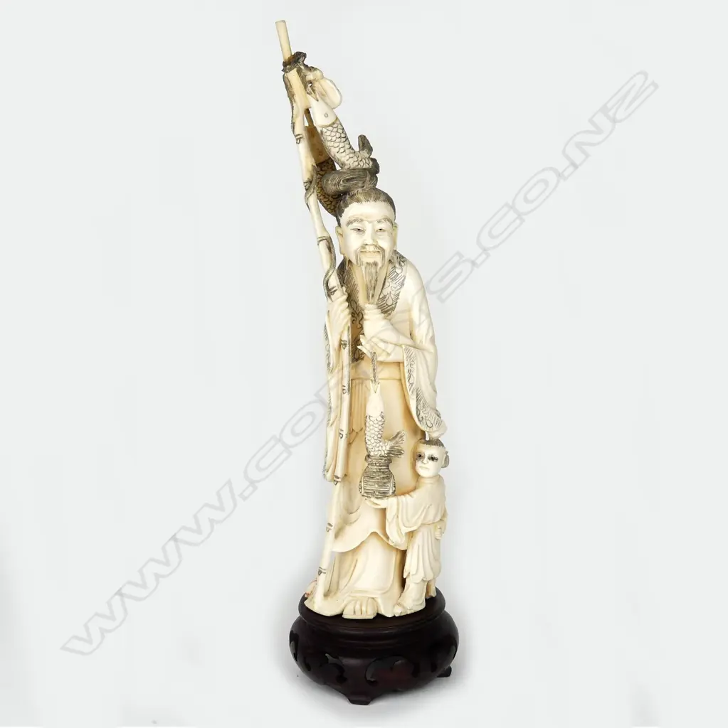 A Japanese old carved ivory figure of a fisherman Image 1++