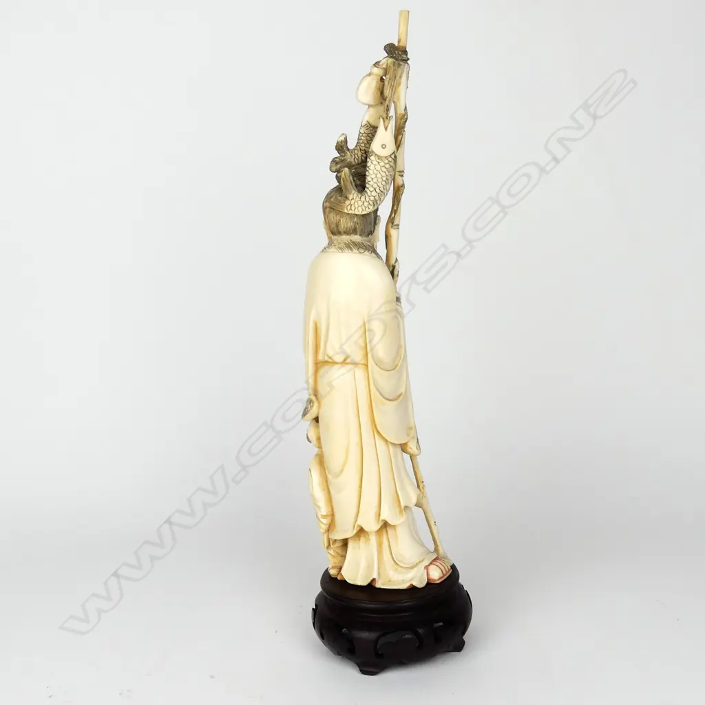A Japanese old carved ivory figure of a fisherman Image 1++