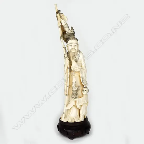 A Japanese old carved ivory figure of a fisherman