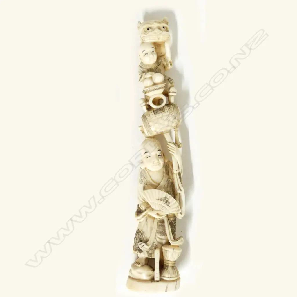 A Japanese carved ivory figure group Image 1++