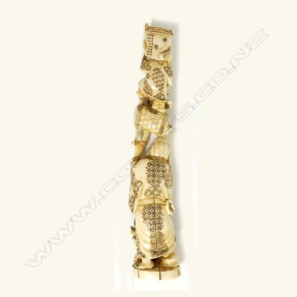 A Japanese carved ivory figure group Image 1++