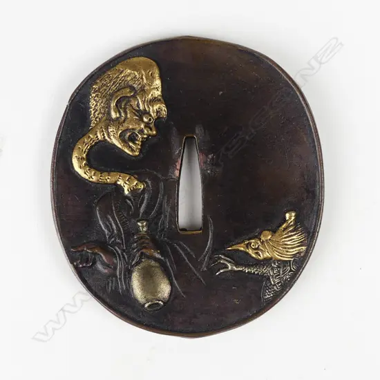 An bronze tsuba type modern ornament