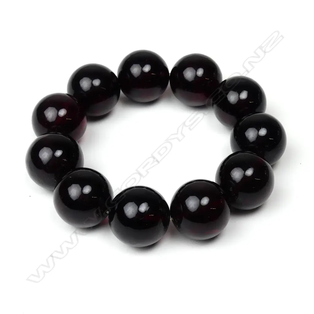 A dark red amber large bead bracelet Image 1++