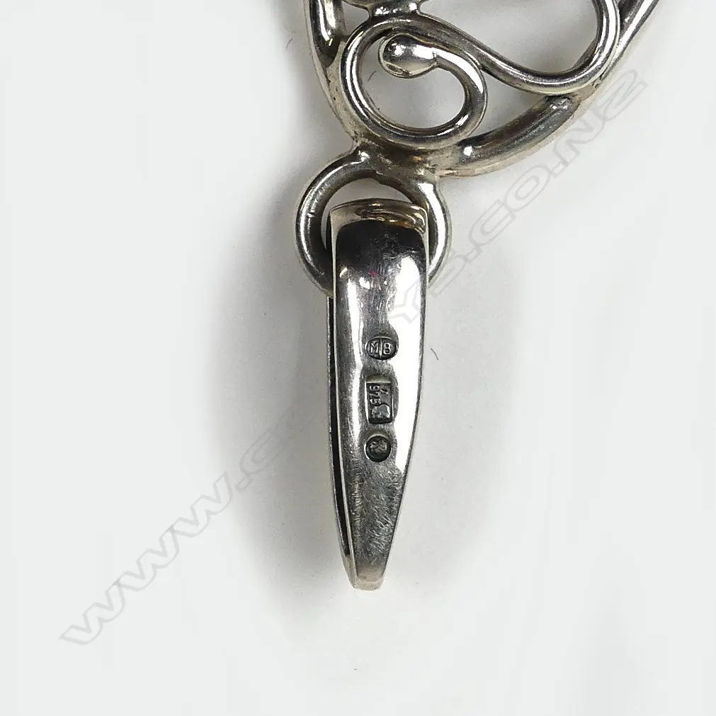 A silver framed amber pendant Image 1++