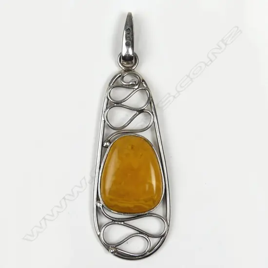 A silver framed amber pendant