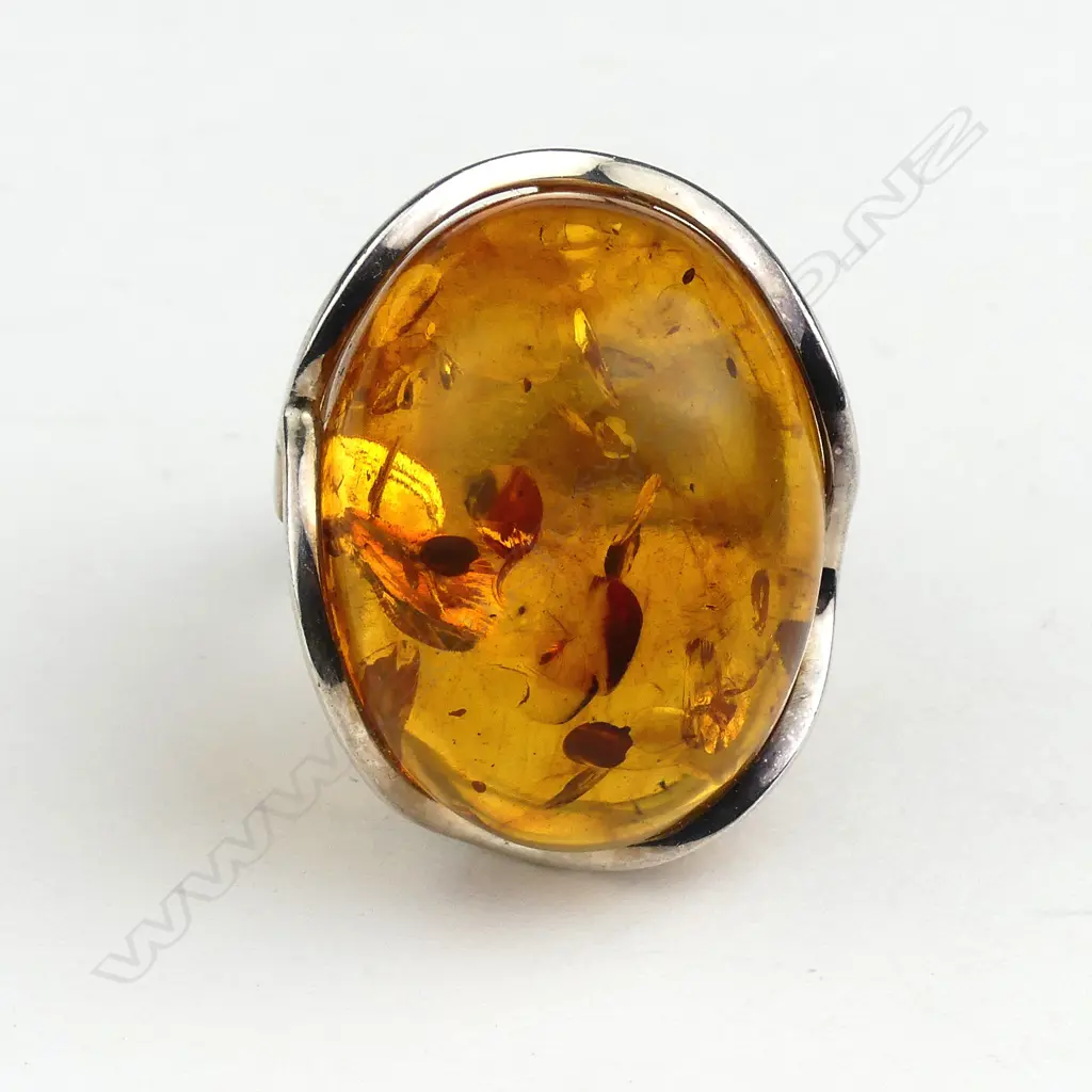 A large polished amber nugget and silver cocktail ring Image 1++