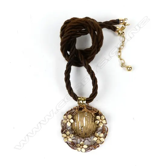 A 15ct gold pendant on a plaited hair necklace