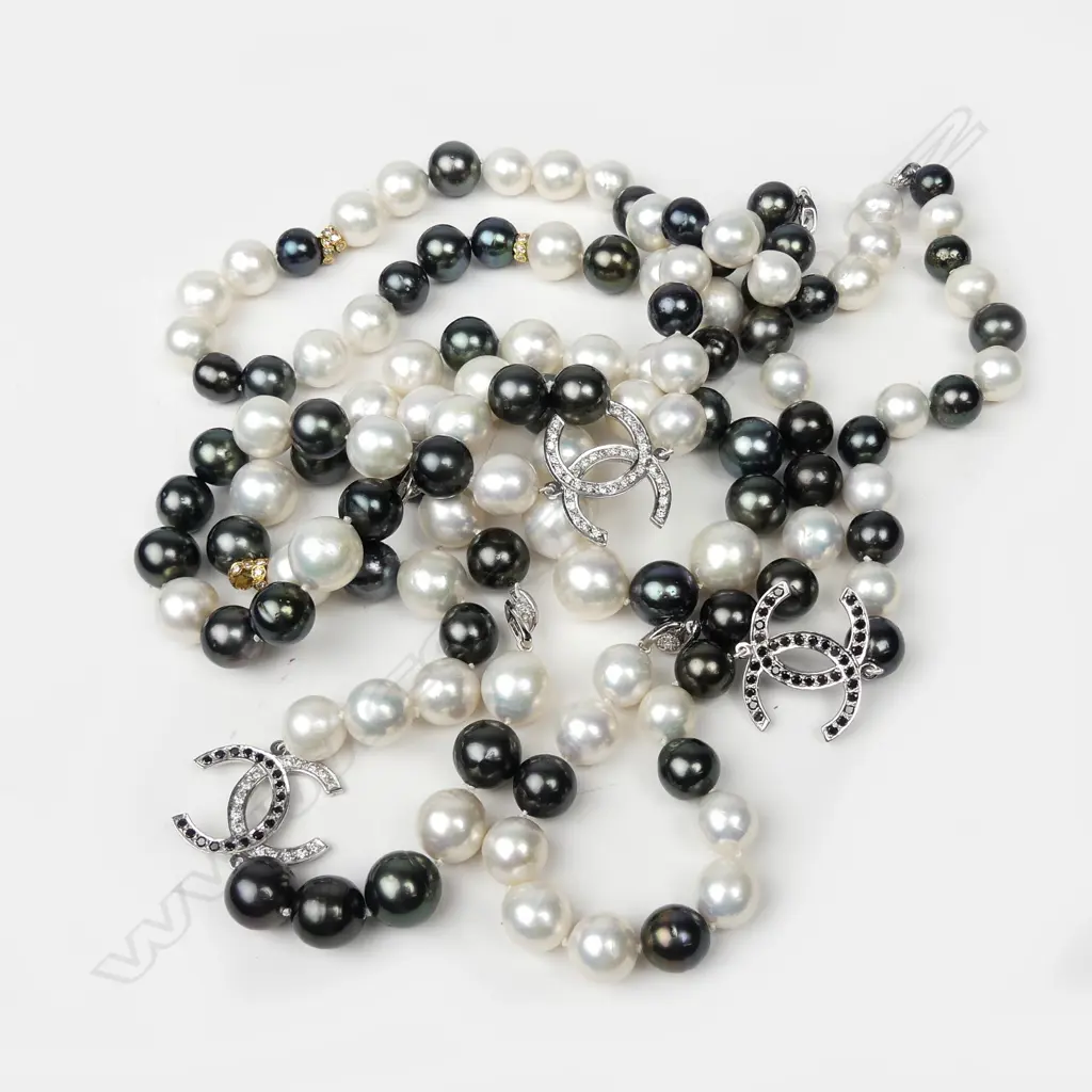 An impressive 14ct white gold diamond and pearl necklace Image 1++