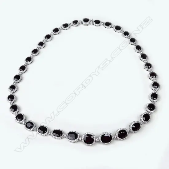 A platinum ruby and diamond necklace