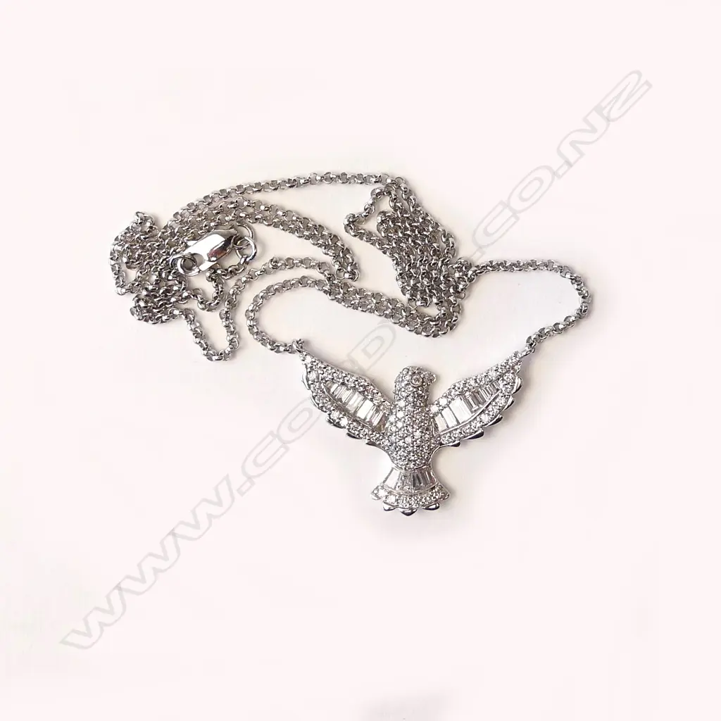 An 18ct white gold and diamond pendant Image 1++