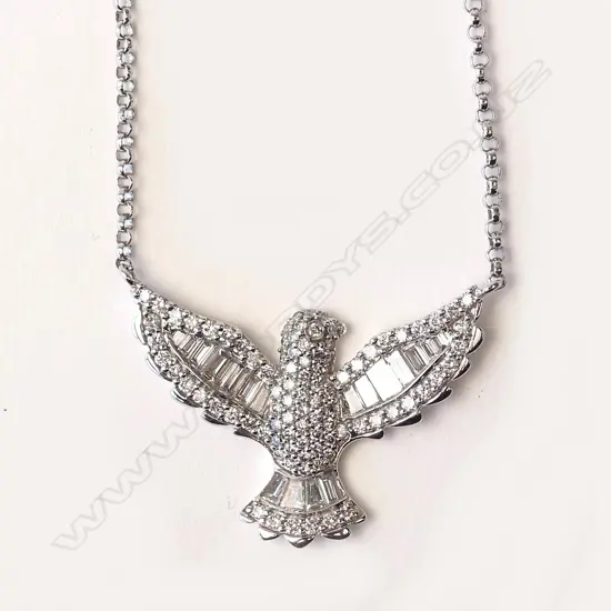 An 18ct white gold and diamond pendant