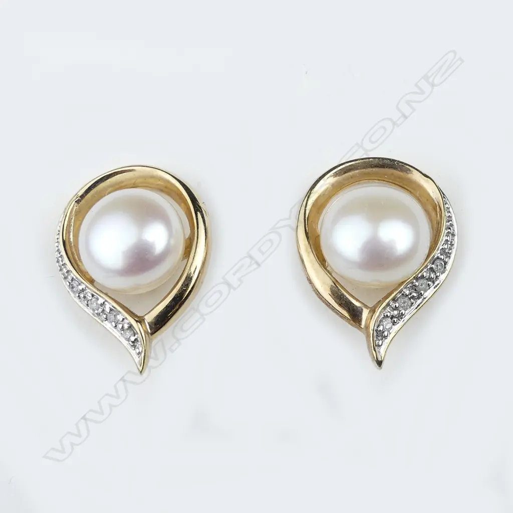 A pair of 9ct gold pearl and diamond earrings Image 1++