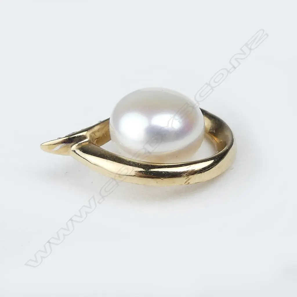 A pair of 9ct gold pearl and diamond earrings Image 1++