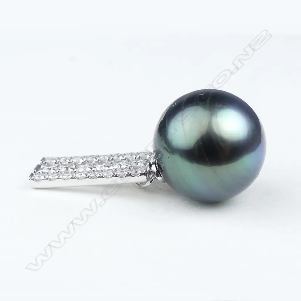 A pair of 14ct white gold pearl and diamond drop earrings Image 1++