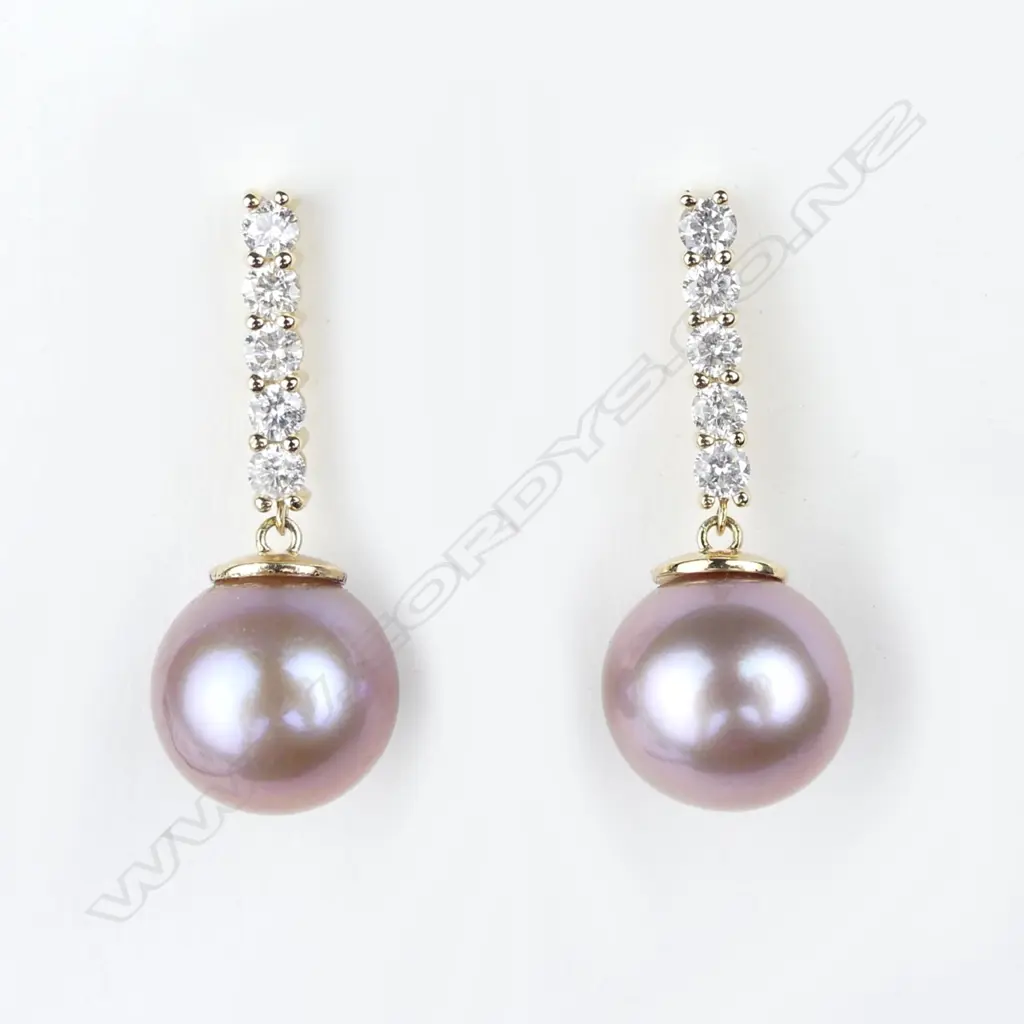A pair of 14ct gold pearl and diamond earrings Image 1++