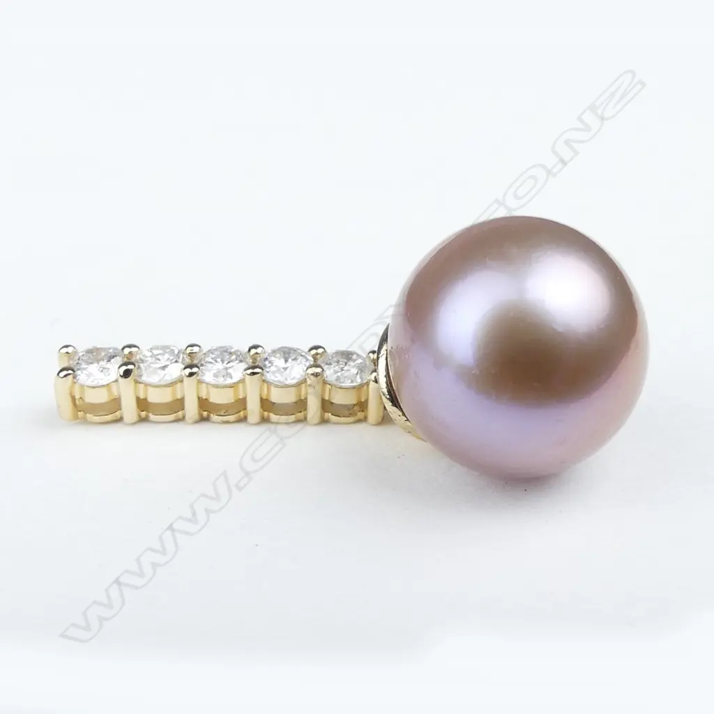 A pair of 14ct gold pearl and diamond earrings Image 1++