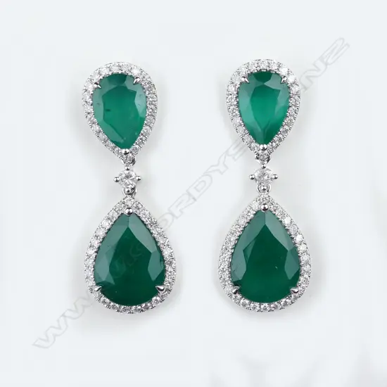 A pair of platinum emerald and diamond drop earrings