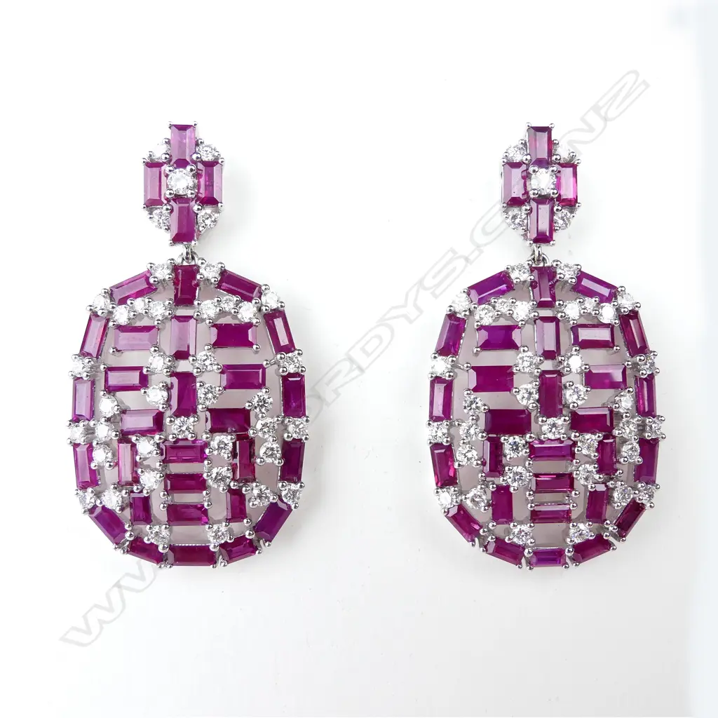 A pair of 18ct white gold ruby and diamond earrings Image 1++