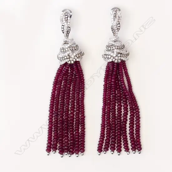 A pair of 18ct white gold diamond and ruby tassel earrings