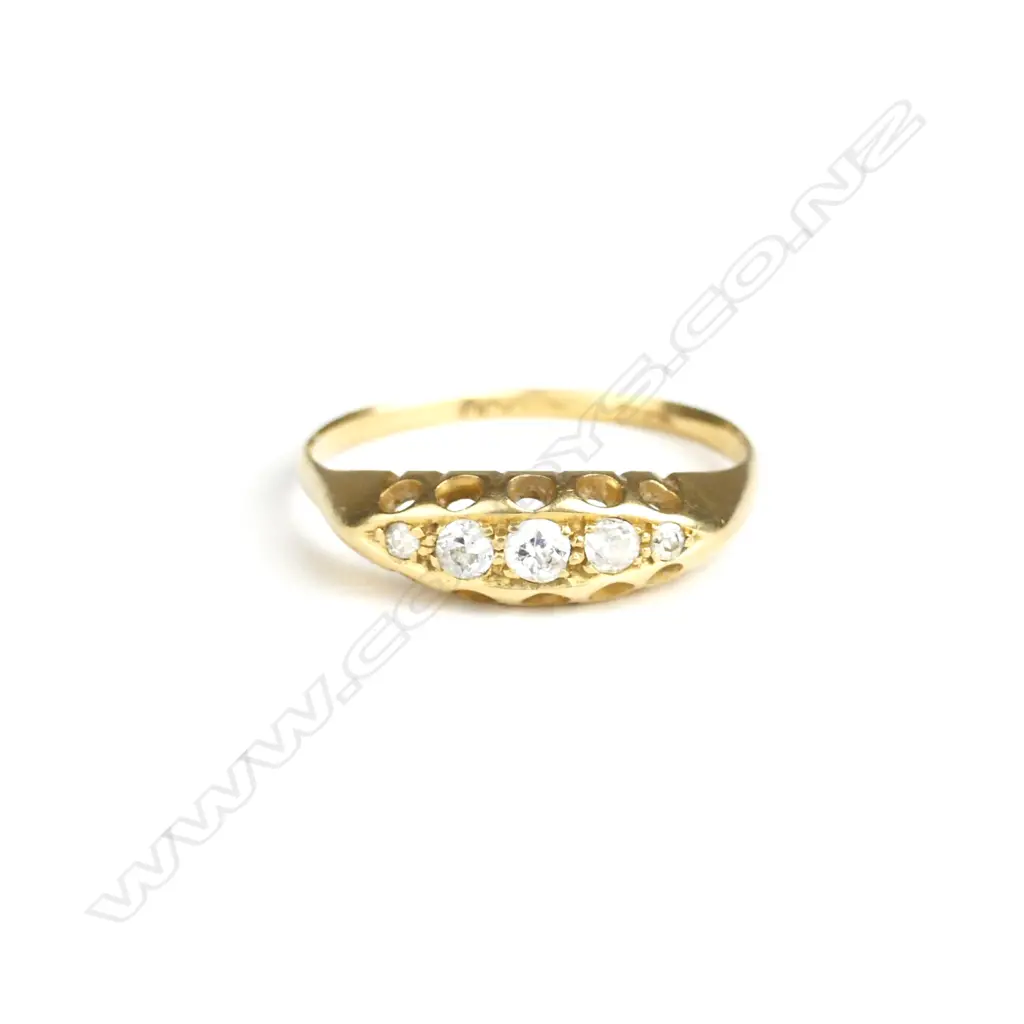 An estate 18ct. gold and diamond bridge ring Image 1++