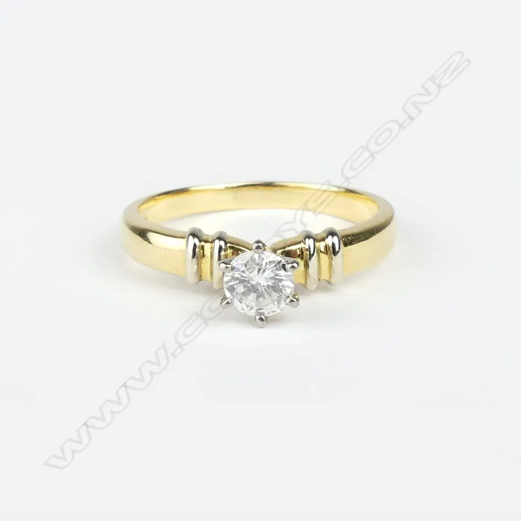 An 18ct. yellow gold and diamond solitaire ring Image 1++