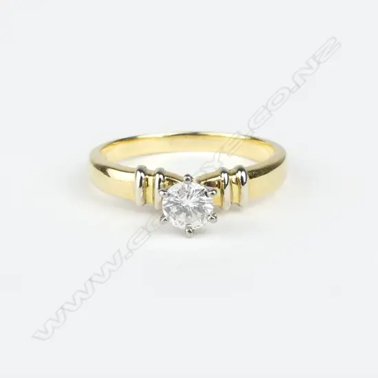 An 18ct. yellow gold and diamond solitaire ring