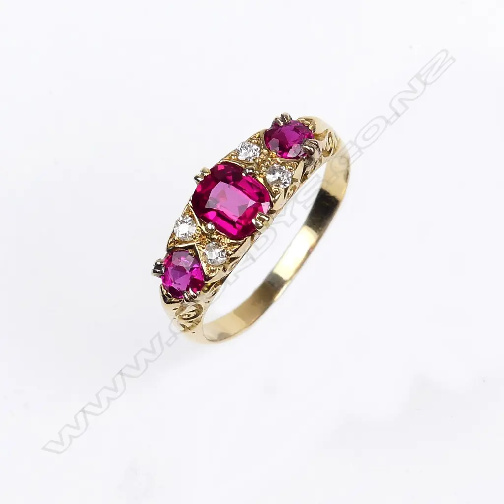 A vintage 18ct diamond and faux ruby ring Image 1++