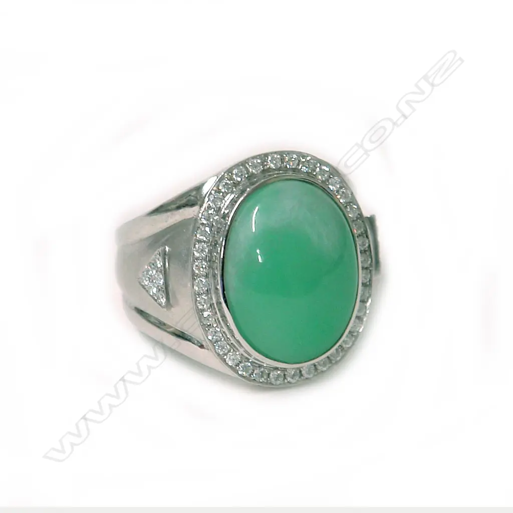 An impressive modern 18ct. white gold jadeite and diamond dress ring Image 1++