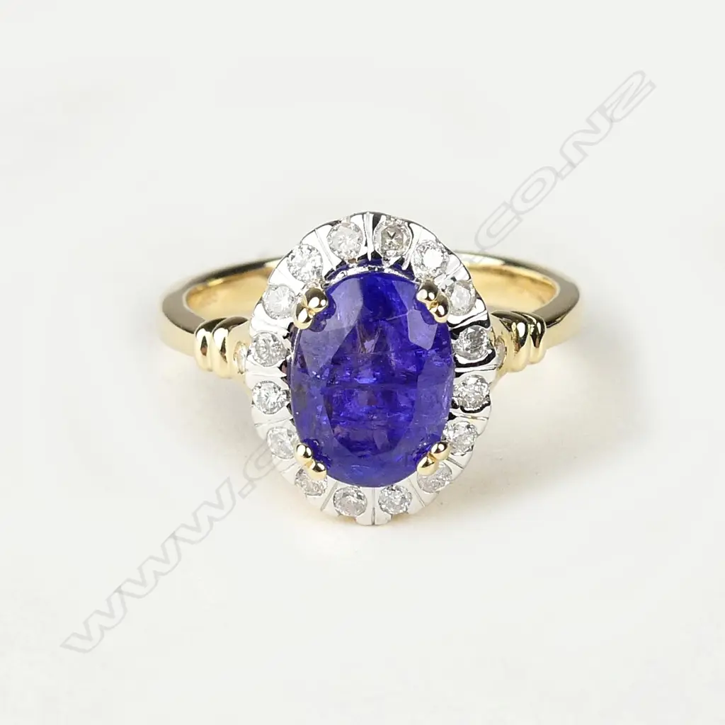 A 14ct gold tanzanite and diamond ring Image 1++