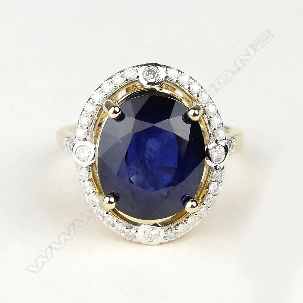 A 14ct gold 9.83ct sapphire and diamond ring Image 1++